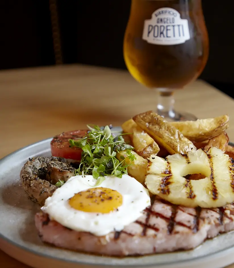 Gammon, egg and chips with a beer